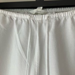 European high fashion linen blend wide pants with drawstring at waist.
